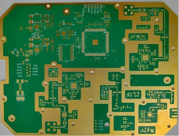 A multi-layered circuit board with a mix of green and gold finishes.