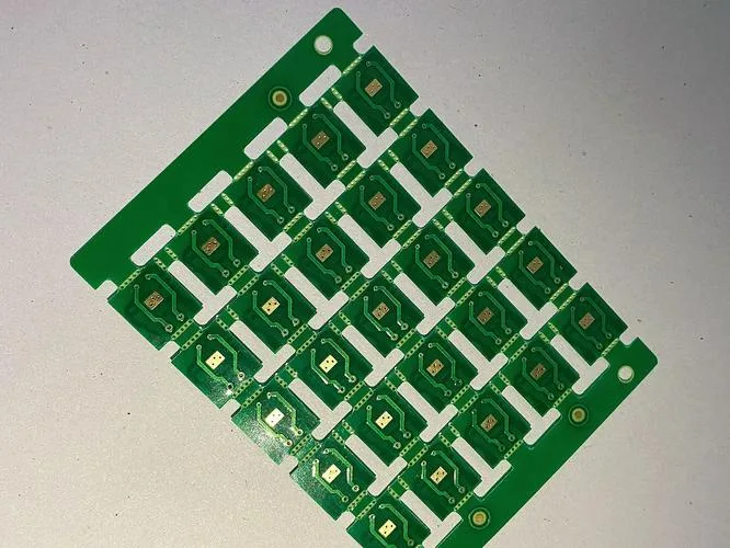  a panelized green Printed Circuit Board (PCB)
