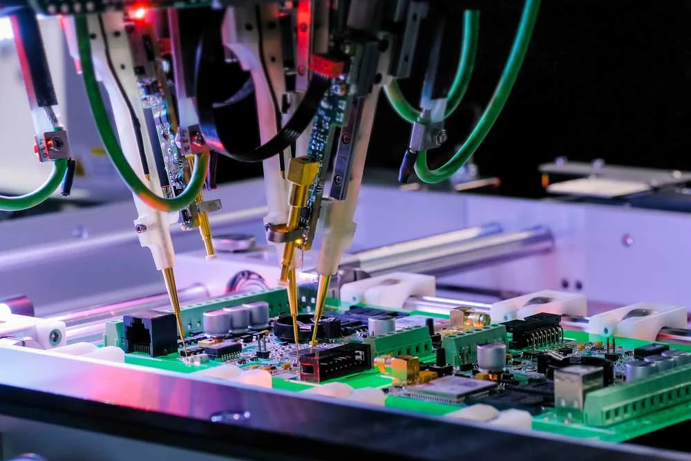 Automated test fixture and oscilloscope probes performing functional verification on an assembled box build unit